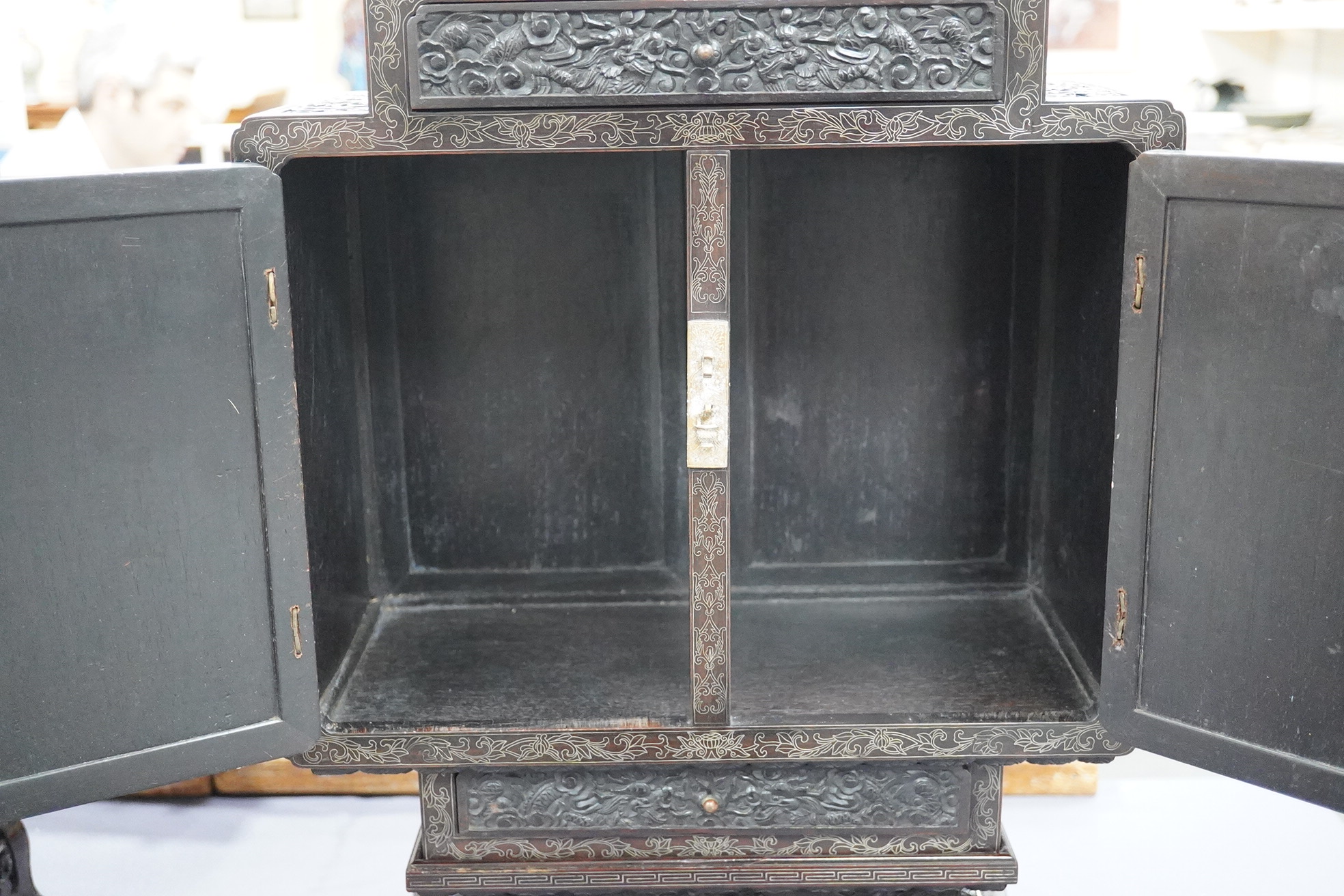 An important pair of Chinese carved zitan and silver wire inlaid ‘cloud and dragon’ curio cabinets and stands, duobaoge, probably Imperial, late Qing dynasty